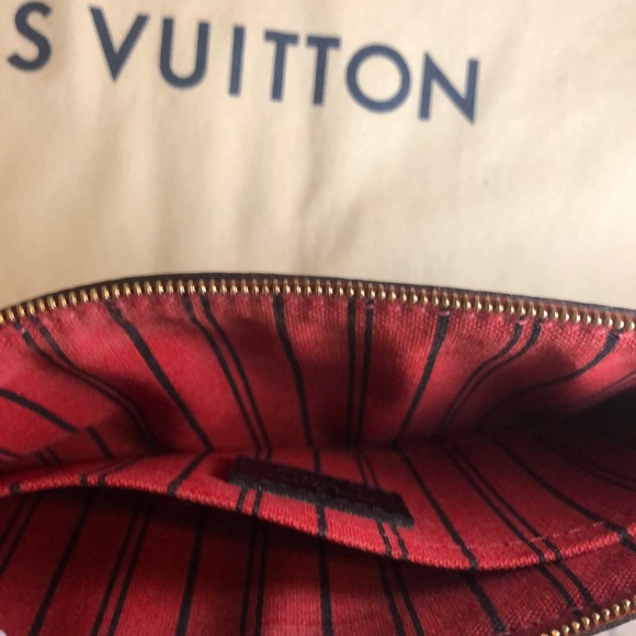 LV wristlet from World Tour collection. Authentic